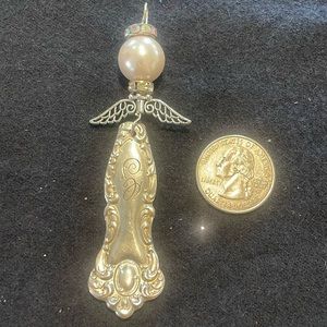 Handmade ornate silver angel pendant/ornament.